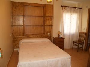 Posteľ alebo postele v izbe v ubytovaní Hostal Tribal