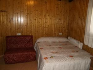 Posteľ alebo postele v izbe v ubytovaní Hostal Tribal