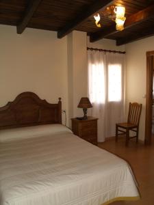 Posteľ alebo postele v izbe v ubytovaní Hostal Tribal