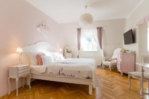 Posteľ alebo postele v izbe v ubytovaní Aurora Vendégház