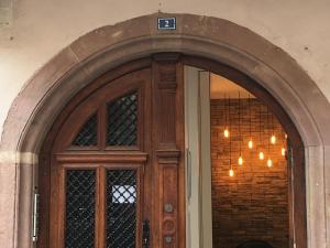 a wooden door with a sign on top of it at Strasbourg Centre Epine in Strasbourg