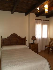Posteľ alebo postele v izbe v ubytovaní Hostal Tribal