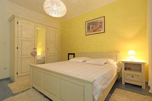 Postel nebo postele na pokoji v ubytování Apartments Sanja