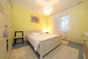 Postel nebo postele na pokoji v ubytování Apartments Sanja