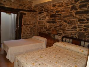 Posteľ alebo postele v izbe v ubytovaní Hostal Tribal