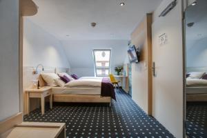 Postel nebo postele na pokoji v ubytování Rhein Neckar Hotel
