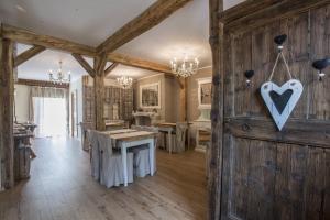 a room with a wooden door with a heart on it at Berry House in Vigolo Vattaro