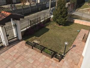 A garden outside Color House Malpensa B&B