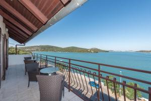 a balcony with a view of the water at Apartment Lidija in Tisno