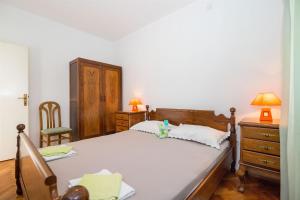 Postel nebo postele na pokoji v ubytování Apartments Petar