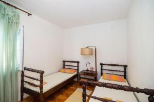 Postel nebo postele na pokoji v ubytování Apartments Petar
