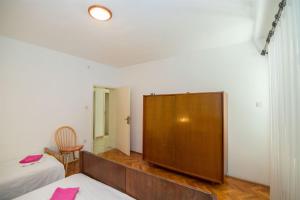 Postel nebo postele na pokoji v ubytování Apartments Petar
