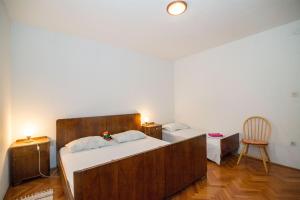 Postel nebo postele na pokoji v ubytování Apartments Petar