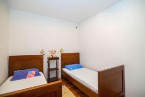Postel nebo postele na pokoji v ubytování Apartments Petar
