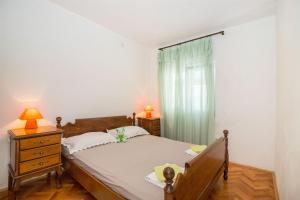 Postel nebo postele na pokoji v ubytování Apartments Petar