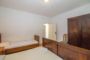 Postel nebo postele na pokoji v ubytování Apartments Petar