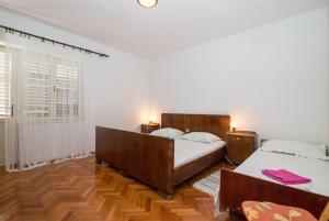 Postel nebo postele na pokoji v ubytování Apartments Petar