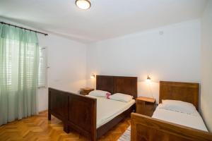 Postel nebo postele na pokoji v ubytování Apartments Petar