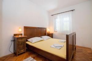 Postel nebo postele na pokoji v ubytování Apartments Petar
