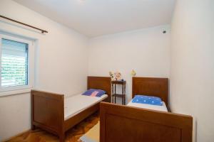 Postel nebo postele na pokoji v ubytování Apartments Petar