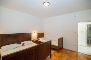 Postel nebo postele na pokoji v ubytování Apartments Petar