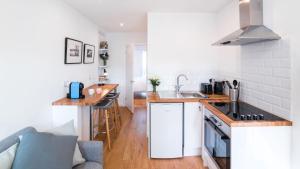 a kitchen with a sink and a counter top at The Wing -Near to the beaches and Bournemouth University in Bournemouth