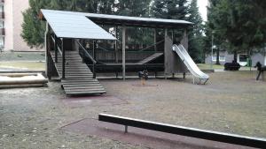 a park with a playground with a slide and a slideintend at Ferienwohnung Heinrich ab 2 Nächte Buchung möglich 1Übernachtung ist nicht möglich in Altenau