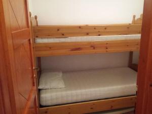 a bedroom with two bunk beds in a closet at Villa Giuseppina in Villasimius