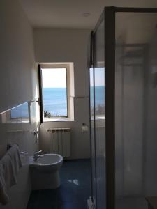 Vannituba majutusasutuses Hotel L'Isola