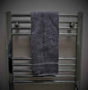 a towel is hanging on top of a dresser at Anchor Inn in Taunton