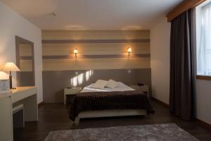 Postel nebo postele na pokoji v ubytování Troia Hotel + 37 fotografií