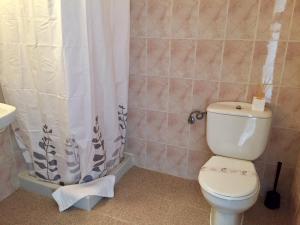 a bathroom with a toilet and a shower curtain at Sol y Luna Cala Millor in Cala Millor