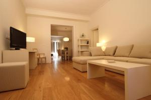 Televízia a/alebo spoločenská miestnosť v ubytovaní Relais Villa Il Palagio
