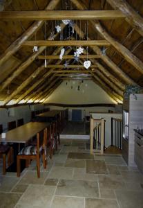 a dining room with a long table and chairs at Domaine des Marequiers chambre Silène in Saint-Germain-du-Teil