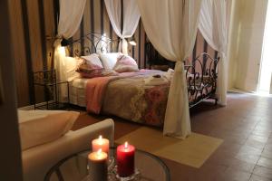 A bed or beds in a room at Aitna B&B