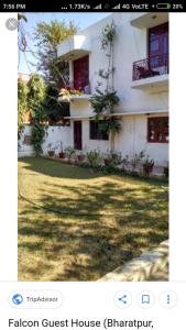a picture of a house with a yard at Falcon guest house in Bharatpur