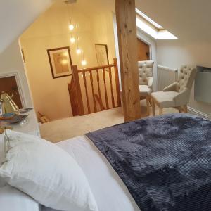 En eller flere senger på et rom på Ugiebrae House Bed & Breakfast