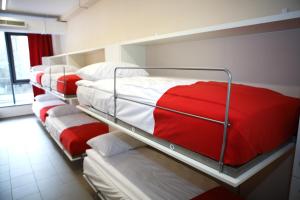 a row of bunk beds in a room at City Express Hostel in Krakow