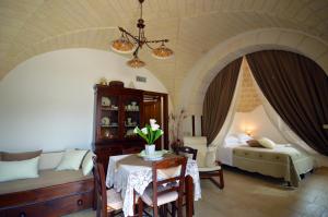 Posteľ alebo postele v izbe v ubytovaní I Trulli Di Nonno Giovanni