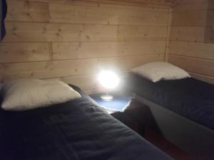 Postel nebo postele na pokoji v ubytování Huvila Uurainen