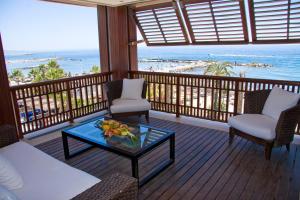 a living room with a view of the beach at Gran Hotel Guadalpín Banus in Marbella