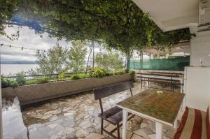 a restaurant with a table and a view of the water at Apartments Anka 20m from the beach in Duće