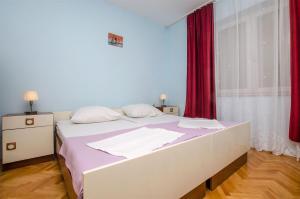 Ένα ή περισσότερα κρεβάτια σε δωμάτιο στο Apartments Anka +35 φωτογραφίες