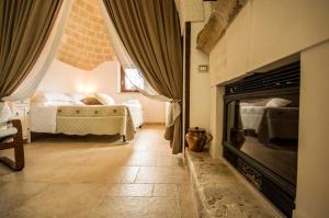 Posteľ alebo postele v izbe v ubytovaní I Trulli Di Nonno Giovanni