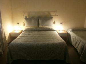 Voodi või voodid majutusasutuse Albergo Vecchio Pavone toas