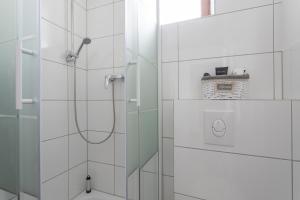 a bathroom with a shower with a glass door at Stylish & Cosy Apartment in Berlin, WiFi in Berlin