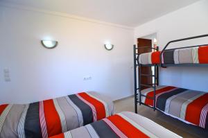 מיטה או מיטות בחדר ב-Casa Teranyina