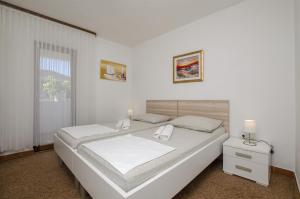 Katil atau katil-katil dalam bilik di Apartments Denis