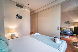 Postel nebo postele na pokoji v ubytování Habitat Apartments Paseo de Gracia Suite