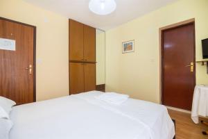 Postel nebo postele na pokoji v ubytování Apartments Rose